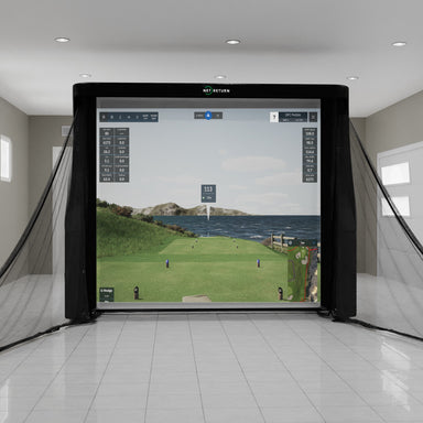 Golf simulator setup in a room with a large screen displaying a golf course.