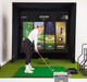 Person using a golf simulator with a screen displaying various activities.
