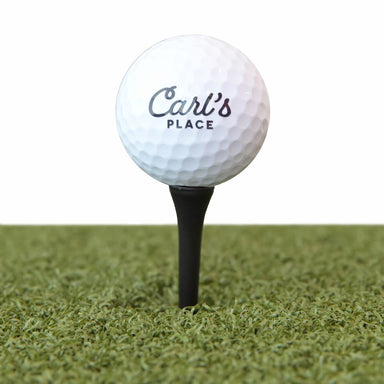 Carl's driver height golf tees on a hitting mat